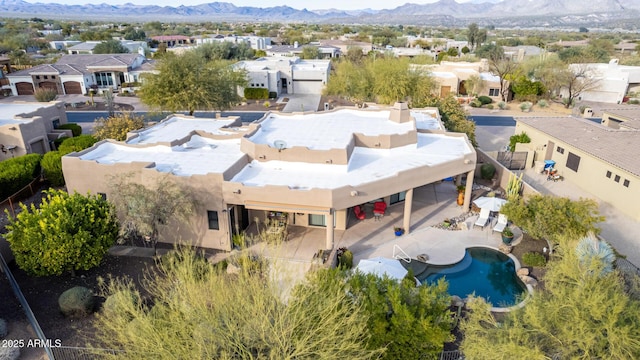 birds eye view of property with a mountain view