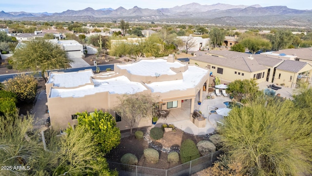 birds eye view of property featuring a mountain view