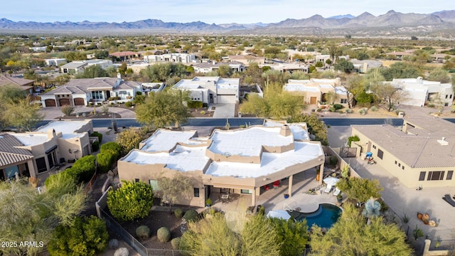 birds eye view of property featuring a mountain view