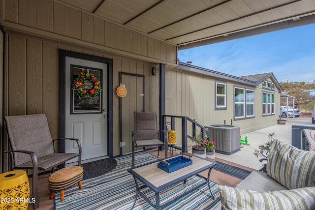 view of patio with outdoor lounge area and central air condition unit