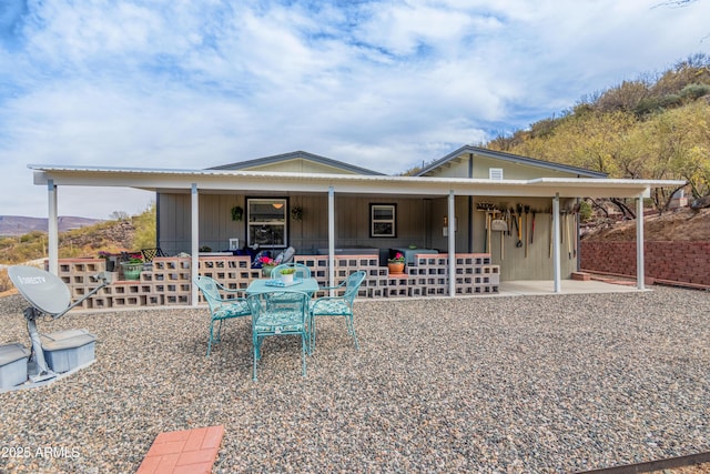 exterior space featuring a patio area and a mountain view