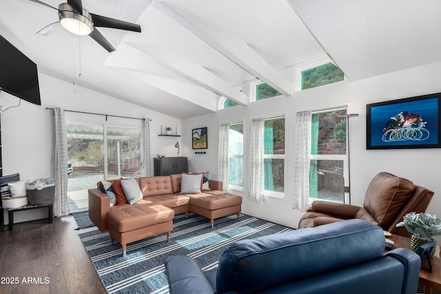 living room featuring dark wood-type flooring, vaulted ceiling with beams, and a ceiling fan