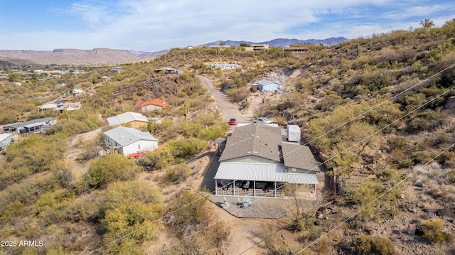 birds eye view of property with a mountain view