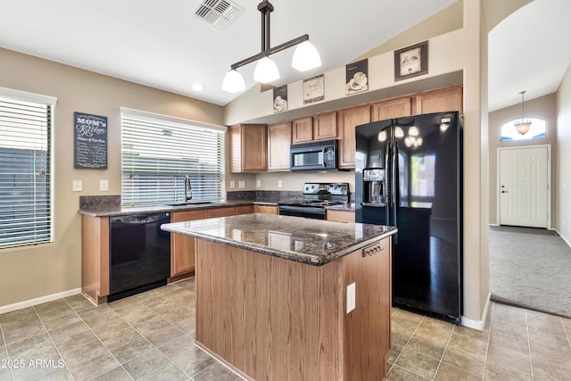 kitchen with a center island, sink, pendant lighting, lofted ceiling, and black appliances