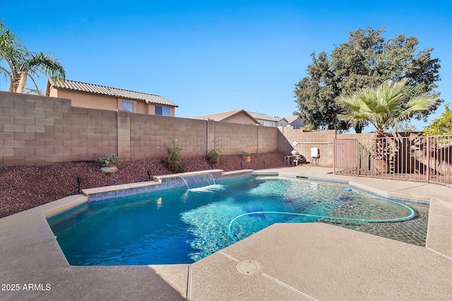 view of swimming pool with pool water feature