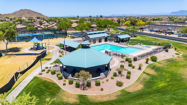 birds eye view of property with a mountain view