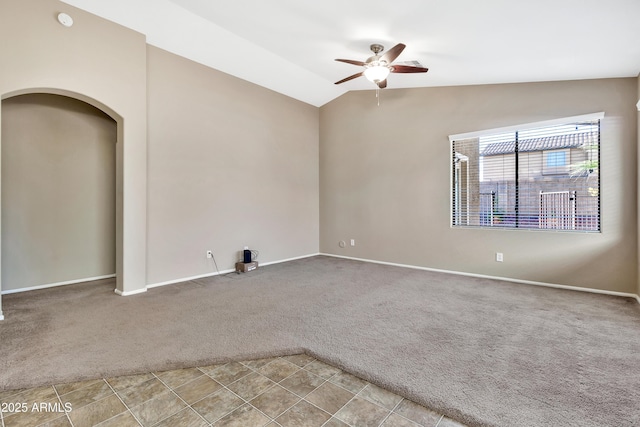 empty room with carpet floors, ceiling fan, and lofted ceiling