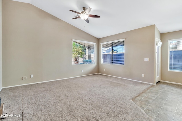 unfurnished room featuring ceiling fan, light colored carpet, and lofted ceiling