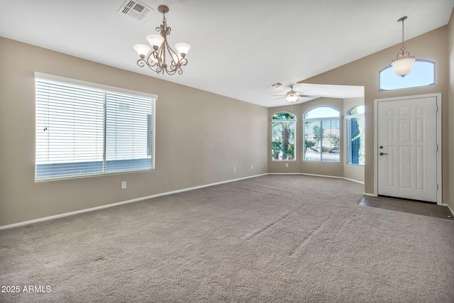 foyer with lofted ceiling, light colored carpet, and ceiling fan with notable chandelier