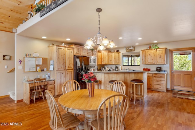 2761 Jaguar Cir, Overgaard, AZ 85933 - dining area with light wood-style floors, recessed lighting, a chandelier, and baseboards