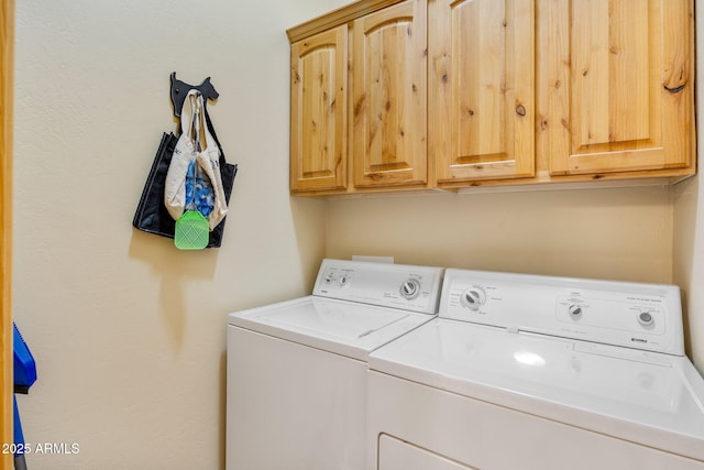 2761 Jaguar Cir, Overgaard, AZ 85933 - washroom featuring separate washer and dryer and cabinet space