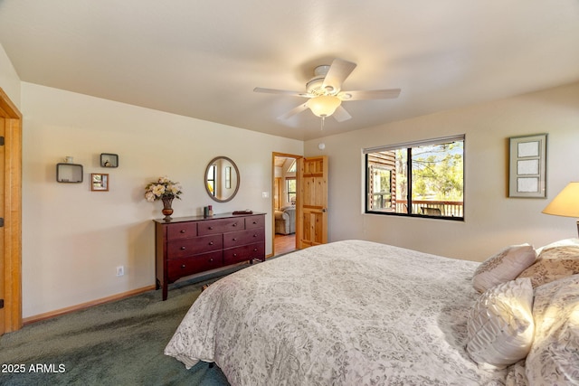 2761 Jaguar Cir, Overgaard, AZ 85933 - bedroom featuring dark colored carpet, baseboards, and ceiling fan