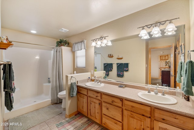 2761 Jaguar Cir, Overgaard, AZ 85933 - bathroom featuring toilet, double vanity, tile patterned flooring, and a shower with shower curtain