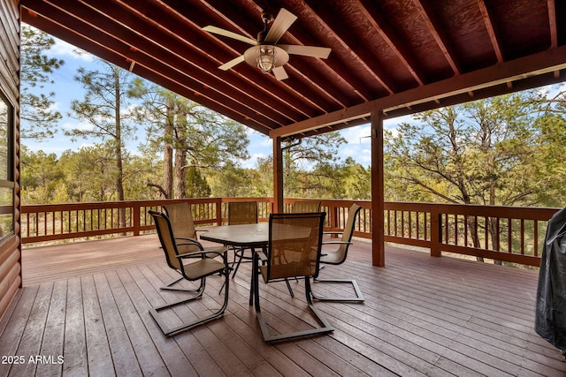 2761 Jaguar Cir, Overgaard, AZ 85933 - deck featuring a ceiling fan, outdoor dining space, and view of scattered trees