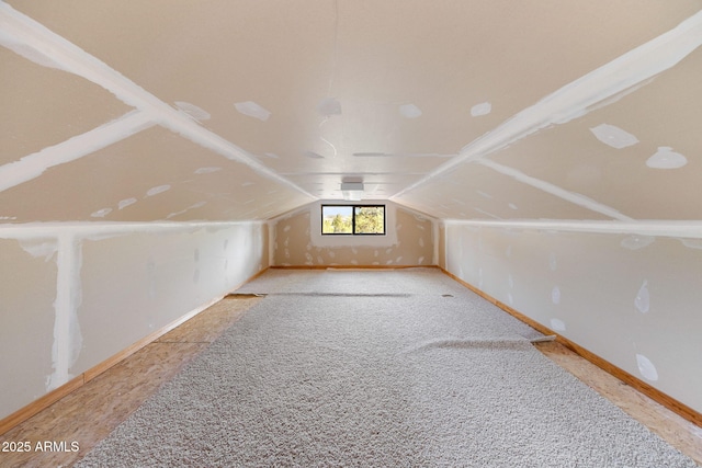 2761 Jaguar Cir, Overgaard, AZ 85933 - additional living space featuring lofted ceiling, carpet, and baseboards