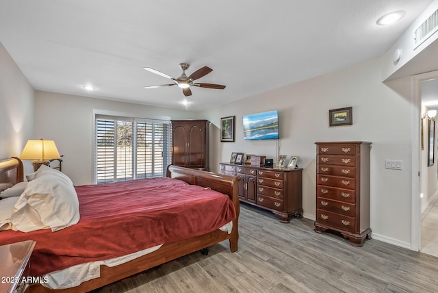 bedroom featuring ceiling fan and light wood-type flooring