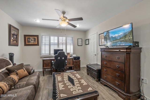 office space with light hardwood / wood-style floors and ceiling fan