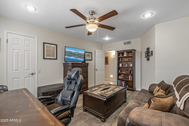 office space featuring ceiling fan and wood-type flooring