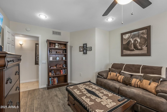 living room featuring ceiling fan