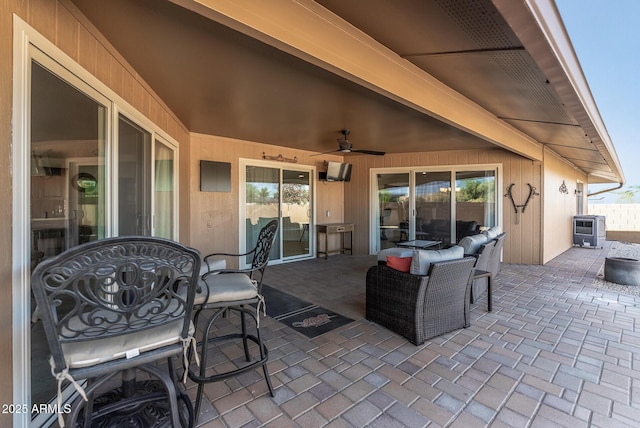 view of patio featuring ceiling fan