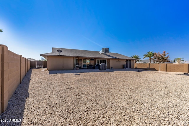 back of property with a patio and cooling unit