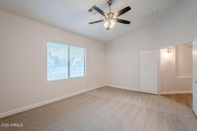 15853 N 74th Ave, Peoria, AZ 85382 - carpeted spare room with lofted ceiling, a ceiling fan, visible vents, and baseboards