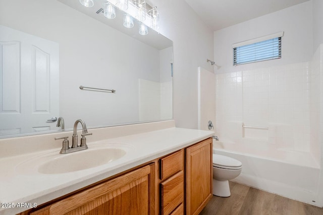 15853 N 74th Ave, Peoria, AZ 85382 - bathroom with wood finished floors, toilet, vanity, and washtub / shower combination