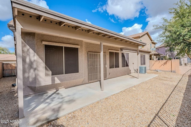 15853 N 74th Ave, Peoria, AZ 85382 - back of property featuring a patio area, cooling unit, a fenced backyard, and stucco siding