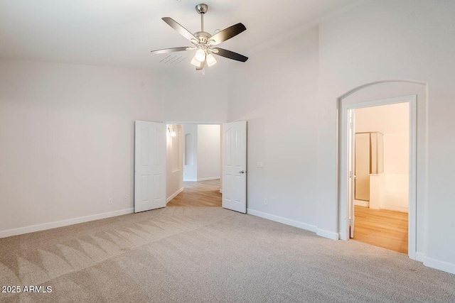 15853 N 74th Ave, Peoria, AZ 85382 - unfurnished bedroom with carpet flooring, a high ceiling, and baseboards