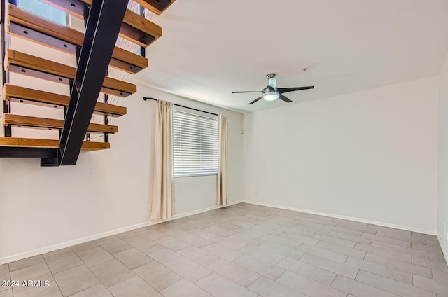 spare room with ceiling fan