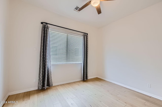 empty room featuring light hardwood / wood-style flooring and ceiling fan