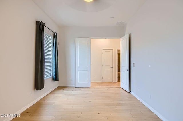 unfurnished bedroom featuring light wood-type flooring