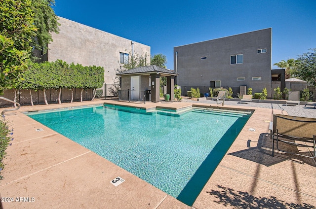 view of swimming pool featuring a patio