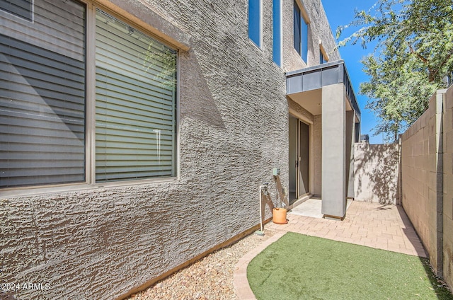 doorway to property with a patio area