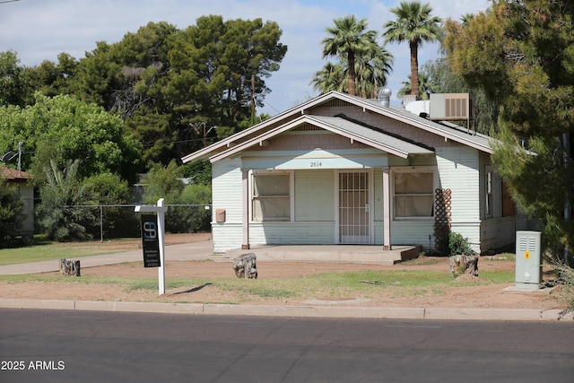 2614 N 26th St, Phoenix, AZ 85008 - bungalow-style home with a porch and cooling unit