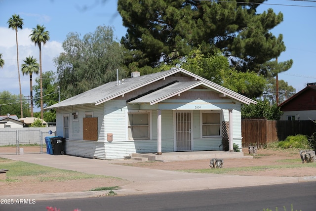 2614 N 26th St, Phoenix, AZ 85008 - bungalow-style home featuring a porch, fence, and concrete driveway