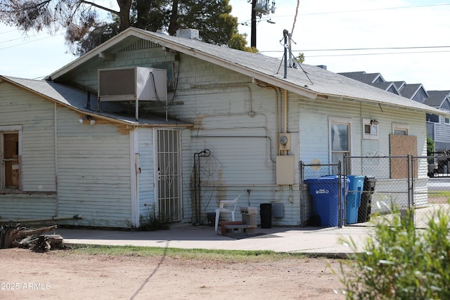 2614 N 26th St, Phoenix, AZ 85008 - rear view of property featuring fence and central air condition unit
