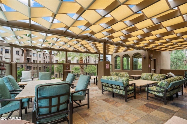 view of patio / terrace with an outdoor hangout area and a pergola