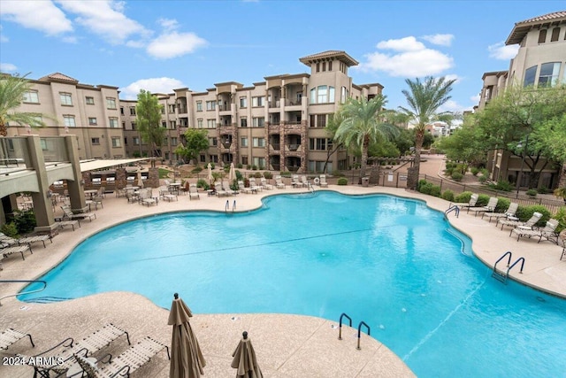 view of swimming pool with a patio area