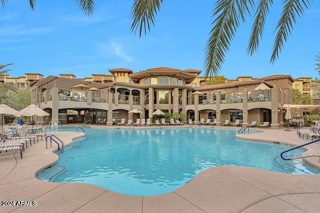 view of swimming pool with a patio