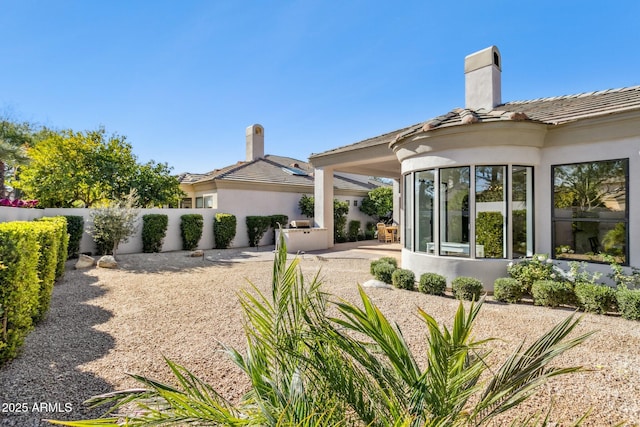 back of property featuring a patio area