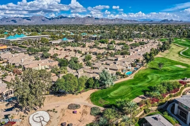 birds eye view of property with a mountain view