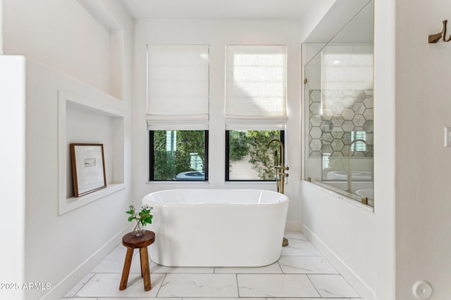 bathroom featuring a tub to relax in