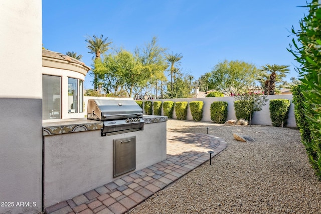 view of patio featuring area for grilling and grilling area