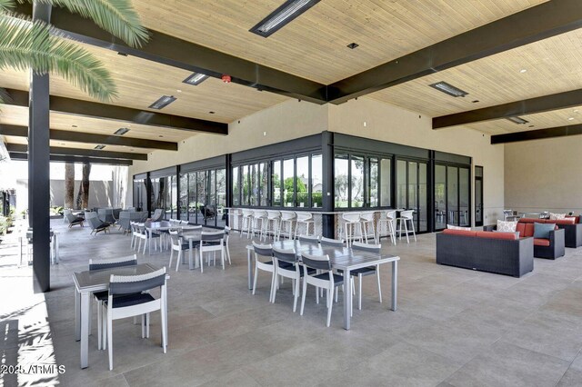 view of patio / terrace with beam ceiling and wood ceiling