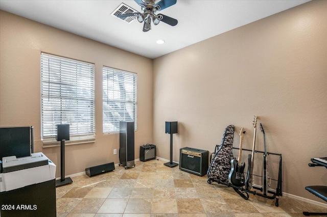 workout room featuring ceiling fan, visible vents, and baseboards