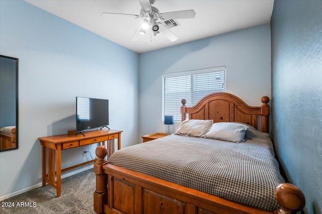 bedroom featuring a ceiling fan, baseboards, visible vents, and carpet flooring