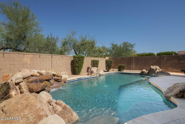 view of pool with a fenced backyard and a fenced in pool