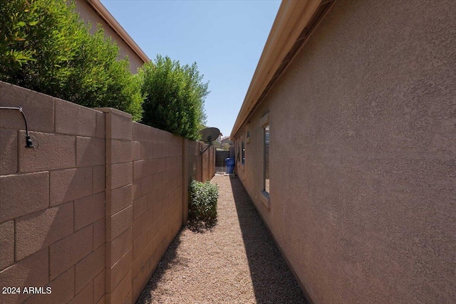 view of property exterior featuring fence and stucco siding