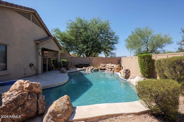 view of swimming pool featuring a fenced backyard and a patio